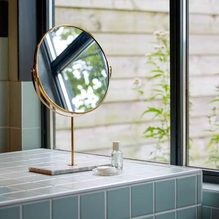 mirror on marble stand